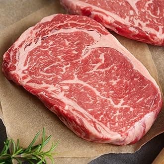 Premium USDA Prime Ribeye Steaks, 8 count, 12 ounces each - Wet Aged and Exquisitely Marbled - Tender as Filet Mignon. Hearty flavor and cooking instructions from Kansas City Steak Company.